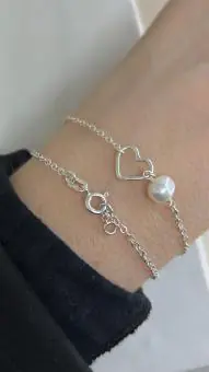 Pulseira coração vazado e perola